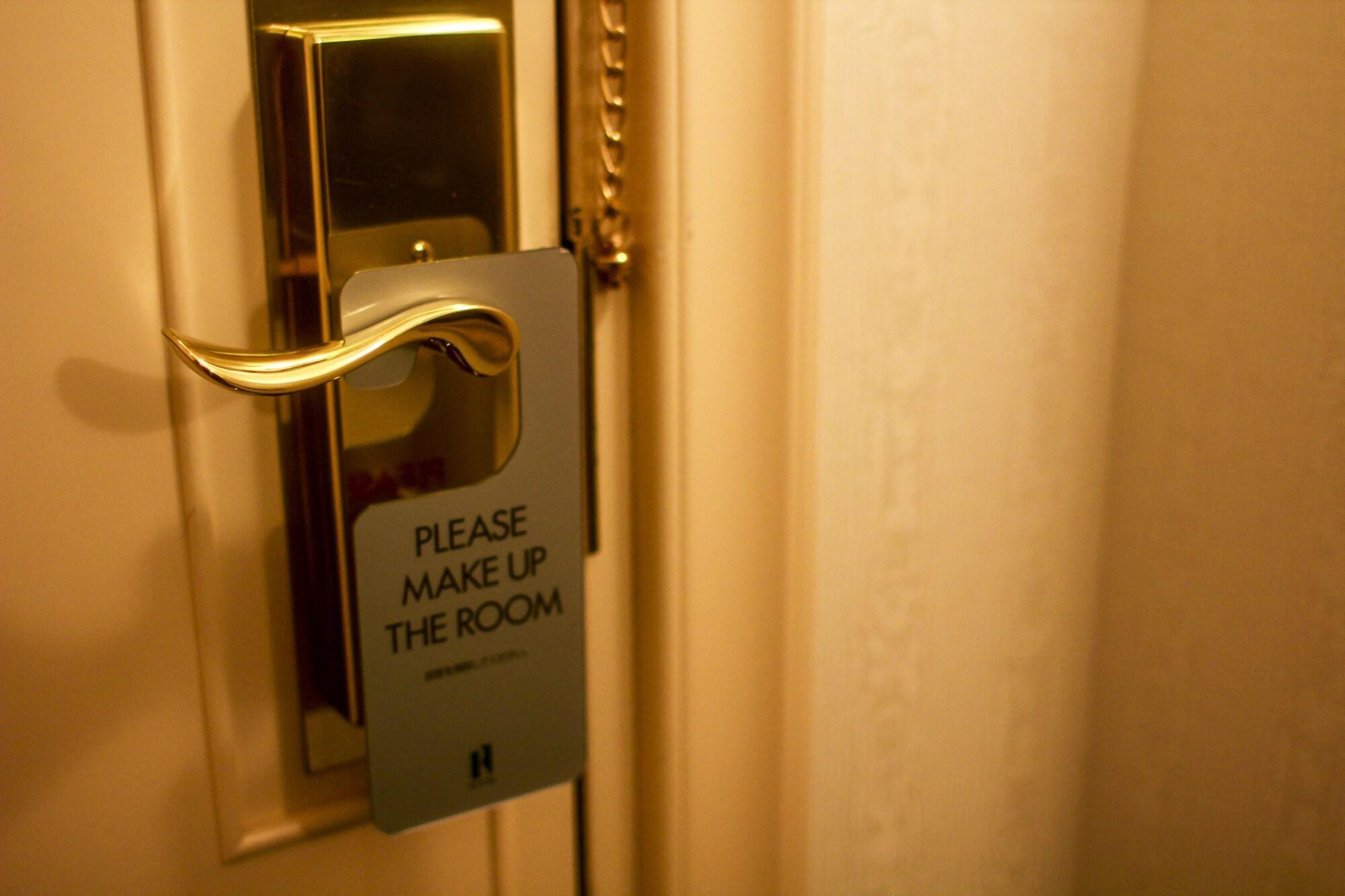 Royton Sapporo Hotel Екстер'єр фото A door sign requesting a maid service